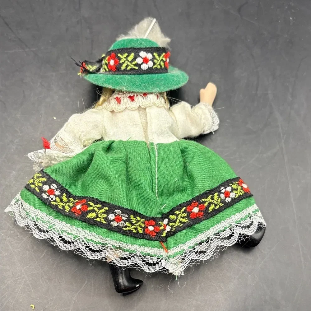 Traditional vintage porcelain doll with Green Hat and Dress